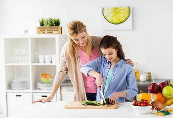 Image showing happy family cooking dinner at home kitchen