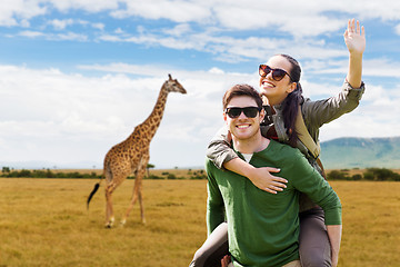 Image showing happy couple with backpacks having fun in africa