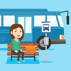 Image showing Business woman waiting at the bus stop.