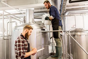 Image showing men working at craft brewery or beer plant