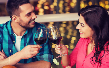 Image showing happy couple dining and drink wine at restaurant