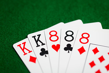 Image showing poker hand of playing cards on green casino cloth