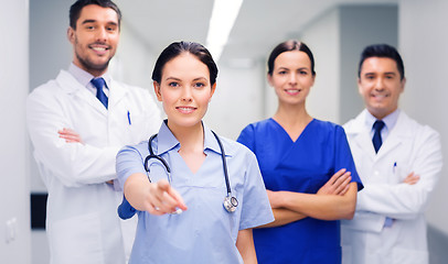 Image showing group of medics pointing finger on you at hospital