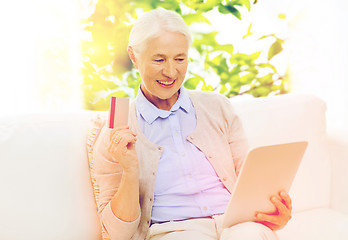 Image showing senior woman with tablet pc and credit card