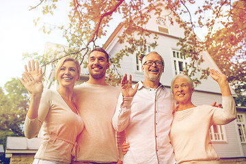 Image showing happy family in front of house outdoors