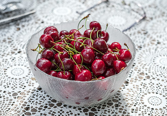 Image showing Fresh cherries in a glass bowl