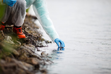 Image showing Laboratory assistant takes water samples