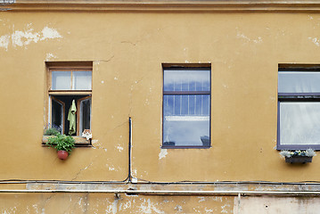 Image showing Orange tabby cat laying on the windowsill