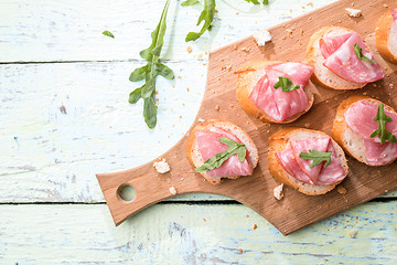 Image showing Baguette , ham on wooden table