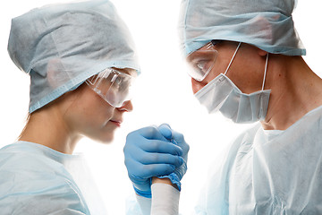 Image showing Doctors in uniform make handshake