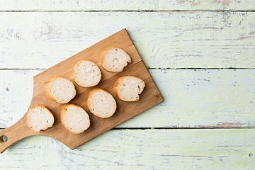 Image showing Cut loaf on wooden table