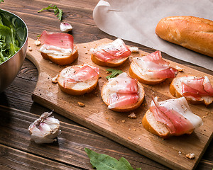 Image showing Baguette with bacon and greens