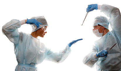 Image showing Fight of doctors with tools