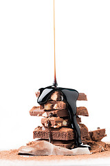 Image showing Tower of chocolate with syrup