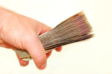 Image showing Ukrainian money in the hand isolated