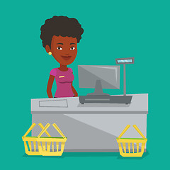 Image showing Cashier standing at the checkout in supermarket.