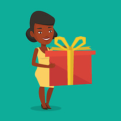 Image showing Joyful african woman holding box with gift.