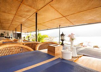 Image showing Tables at a cafe next to lake