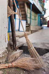 Image showing Traditional wooden brooms
