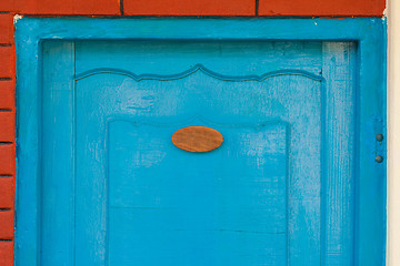 Image showing Wooden door with number sign