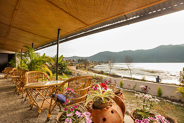 Image showing Tables at a cafe next to lake