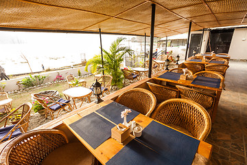 Image showing Tables at a cafe next to lake