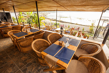 Image showing Tables at a cafe next to lake