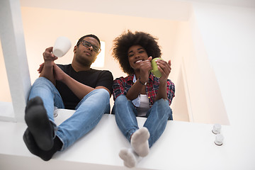 Image showing couple having break during moving to new house