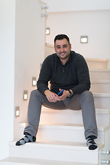 Image showing man sitting on the stairs