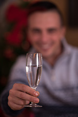 Image showing Happy young man with a glass of champagne