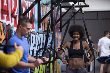 Image showing Portrait of multiethnic couple  after workout at gym