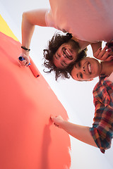 Image showing couple painting interior wall