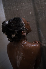 Image showing African American woman in the shower