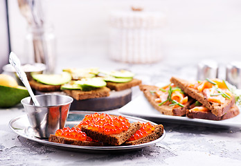 Image showing bread with red salmon caviar 