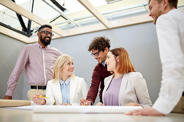 Image showing business team with blueprint project at office