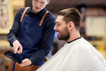 Image showing barber showing tablet pc to man at barbershop