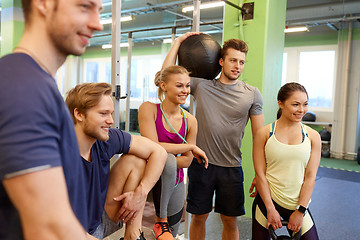 Image showing group of friends with sports equipment in gym