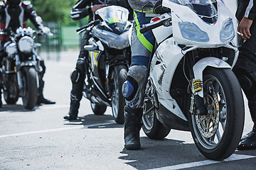 Image showing Motorcycle luxury items close-up: headlights, shock absorber, wheel, wing, toning.