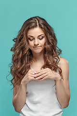 Image showing The young woman\'s portrait with thoughtful emotions