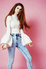 Image showing cute pretty redhair teenage girl smiling cheerful on pink background, lifestyle modern people concept 