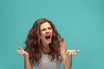 Image showing Portrait of young woman with shocked facial expression