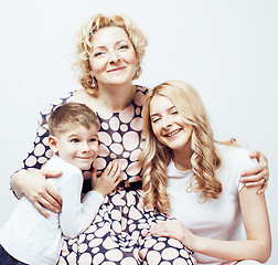 Image showing happy smiling family together posing cheerful on white background, lifestyle people concept, mother with son and teenage daughter isolated 