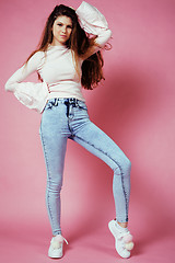 Image showing cute pretty redhair teenage girl smiling cheerful on pink background, lifestyle modern people concept