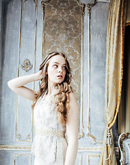 Image showing pretty blond curly hairstyle girl in luxury house interior alone, rich young people concept 