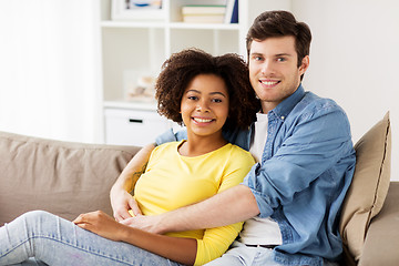 Image showing happy smiling international couple at home