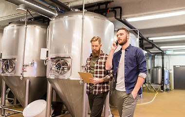 Image showing men working at craft brewery or beer plant