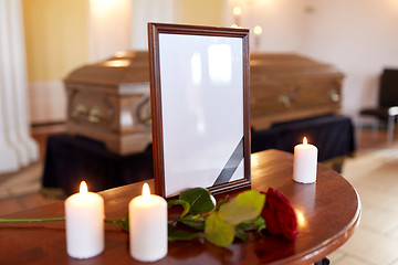 Image showing photo frame and coffin at funeral in church