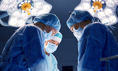 Image showing group of surgeons in operating room at hospital