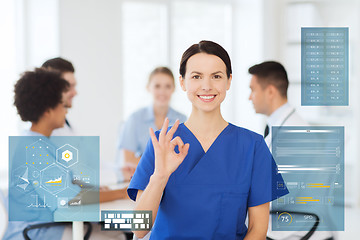 Image showing happy doctor at hospital showing ok hand sign