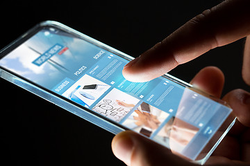 Image showing hands with business web page on smartphone screen